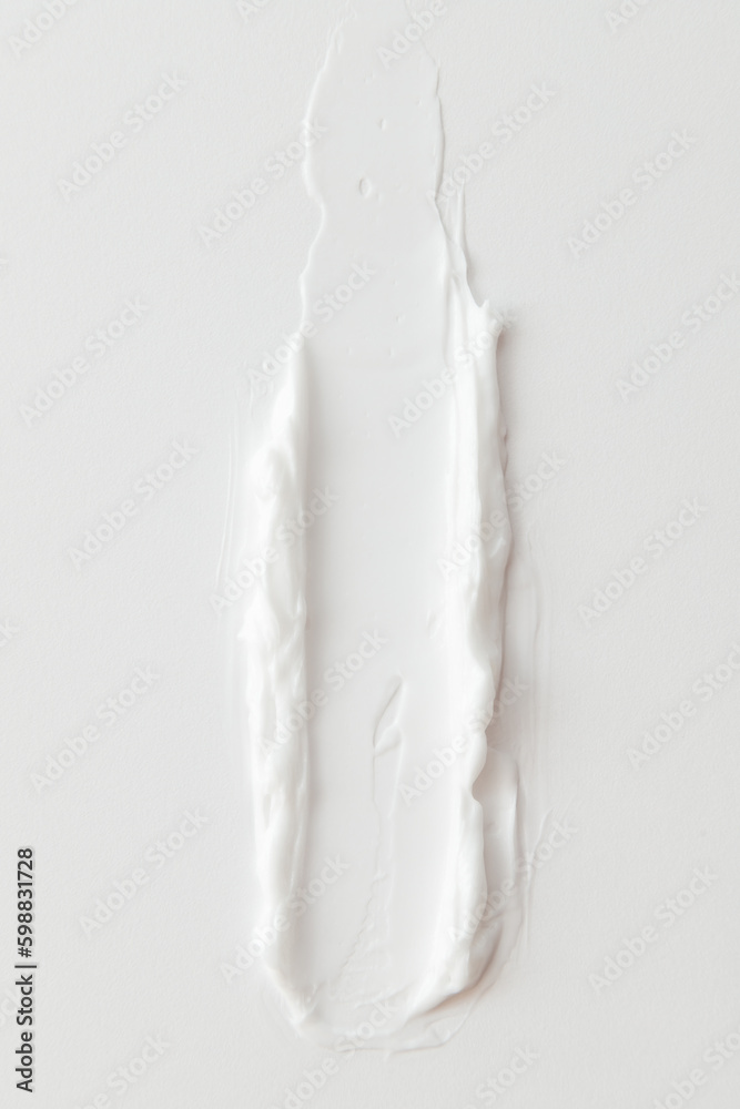 Macro shot of White Cosmetic Cream Smear on White Background. Day cream advertisement Macro shot of White Cosmetic Cream Smear on White Background. Day cream advertisement