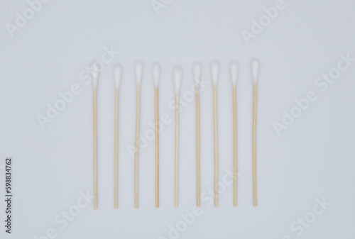 Neatly arranged medical white cotton swabs