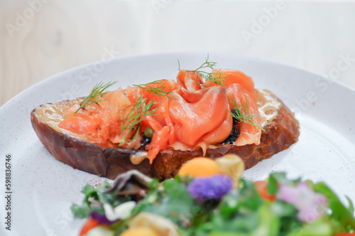 salmon canape or bread with salmon and caviar topping