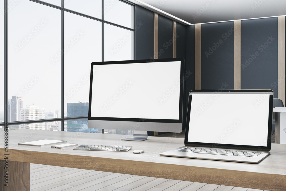 Fototapeta premium Contemporary designer office desktop with empty white mock up computer screens, supplies and blurry interior with windows and city view background. 3D Rendering.