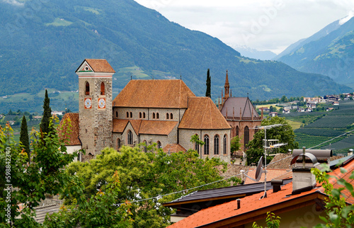 Mediterranean landscape in the Italian Alps with the old parish Church of Scena (Schenna) in Merano (Meran) region in South Tyrol (South Tirol), Italy
