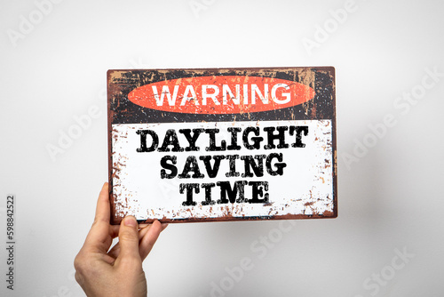 Daylight Saving Time. Warning sign with text on a white background