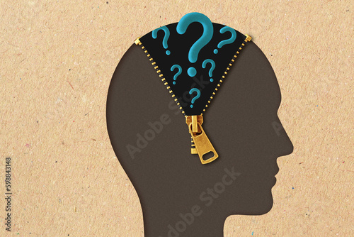 Man head profile with open zipper and question marks - Concept of open mind, hidden thoughts and curiosity photo