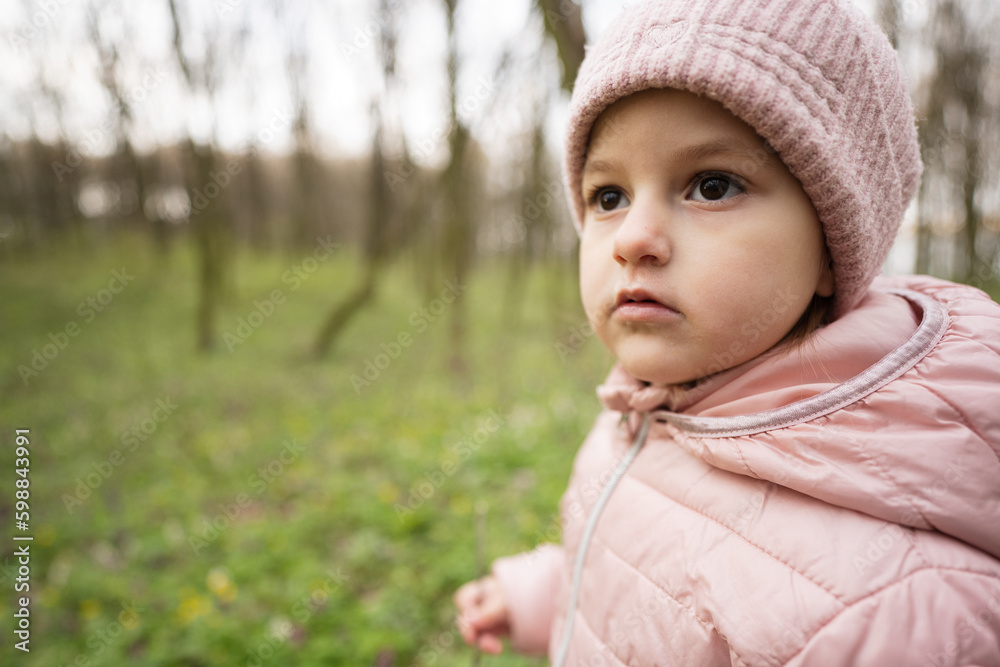 Portrait of baby girl in spring forest. Happy childhood. Portrait of baby girl in spring forest. Happy childhood.