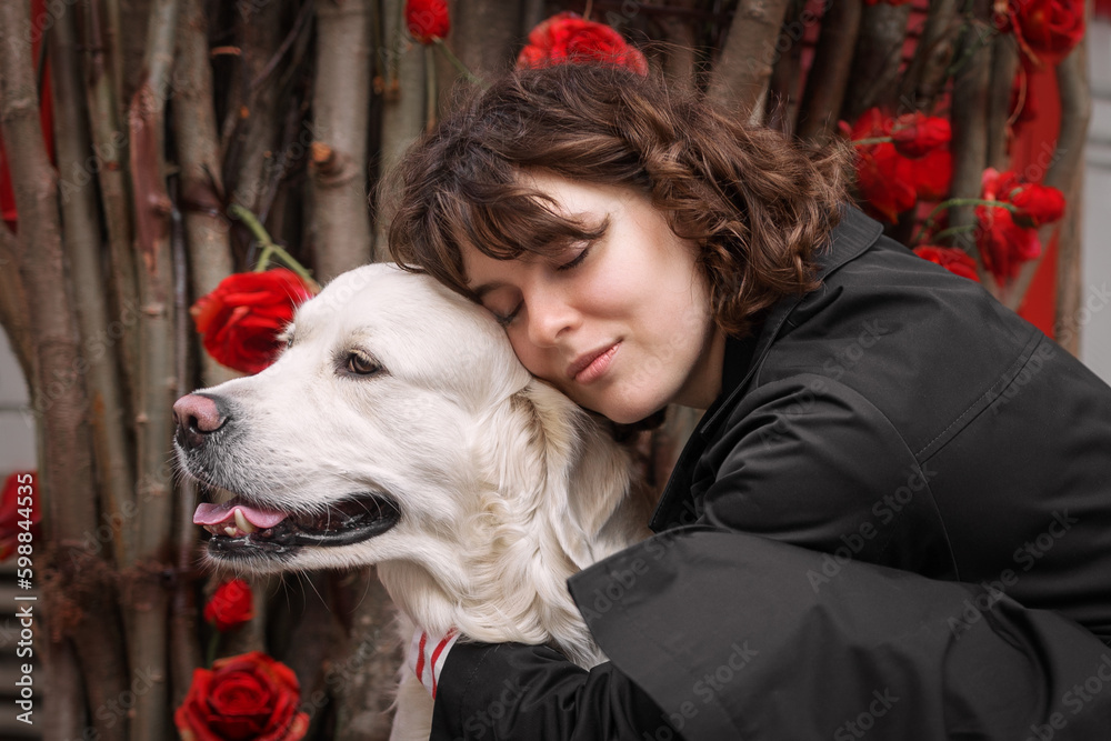 Cute funny girl portrait with her golden dog