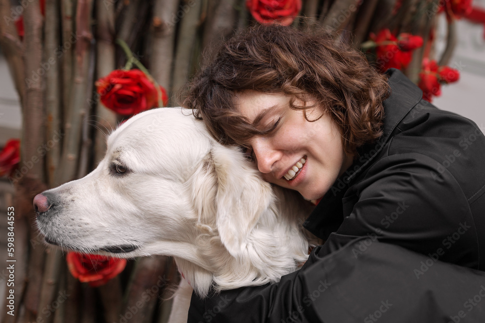 Cute funny girl portrait with her golden dog