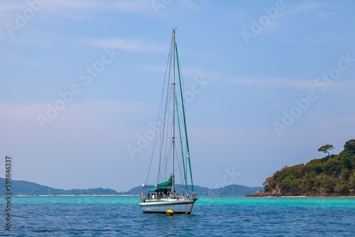 Fototapeta Naklejka Na Ścianę i Meble -  A yacht with masts in the Andaman Sea for traveling with family and friends. Voyage while on vacation in hot countries.