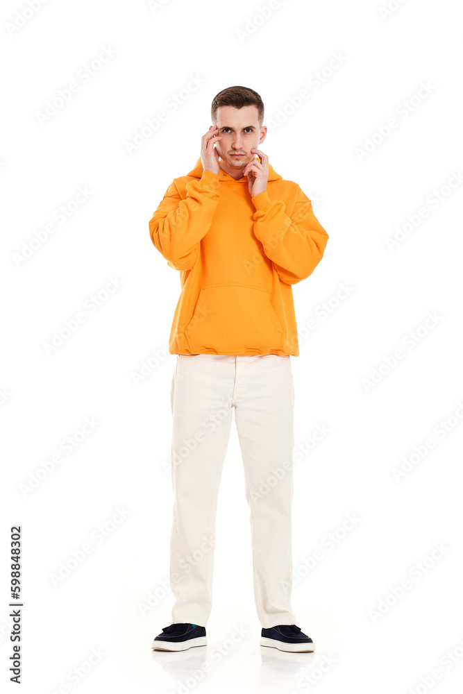 thoughtful young man thinking and looking at the camera thoughtful young man thinking and looking at the camera