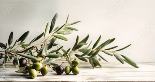 olive branch against a white wooden background,
