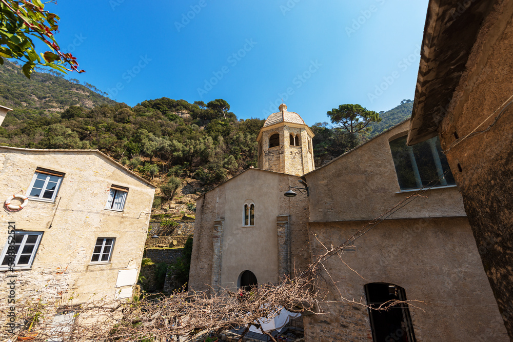 Facade of the ancient San Fruttuoso Abbey (San Fruttuoso di Capodimonte), X-XI century, place of worship between Portofino and Camogli, Genoa province (Genova), Liguria, Italy, Europe. Facade of the ancient San Fruttuoso Abbey (San Fruttuoso di Capodimonte), X-XI century, place of worship between Portofino and Camogli, Genoa province (Genova), Liguria, Italy, Europe.