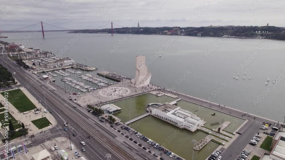 Circling aerial of Lisbon Waterfront with Padrao dos Descobrimentos Monument