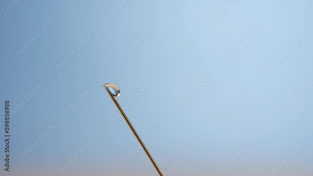 Extreme close-up injection syringe needle, droplets and vaccine splash out Extreme close-up injection syringe needle, droplets and vaccine splash out