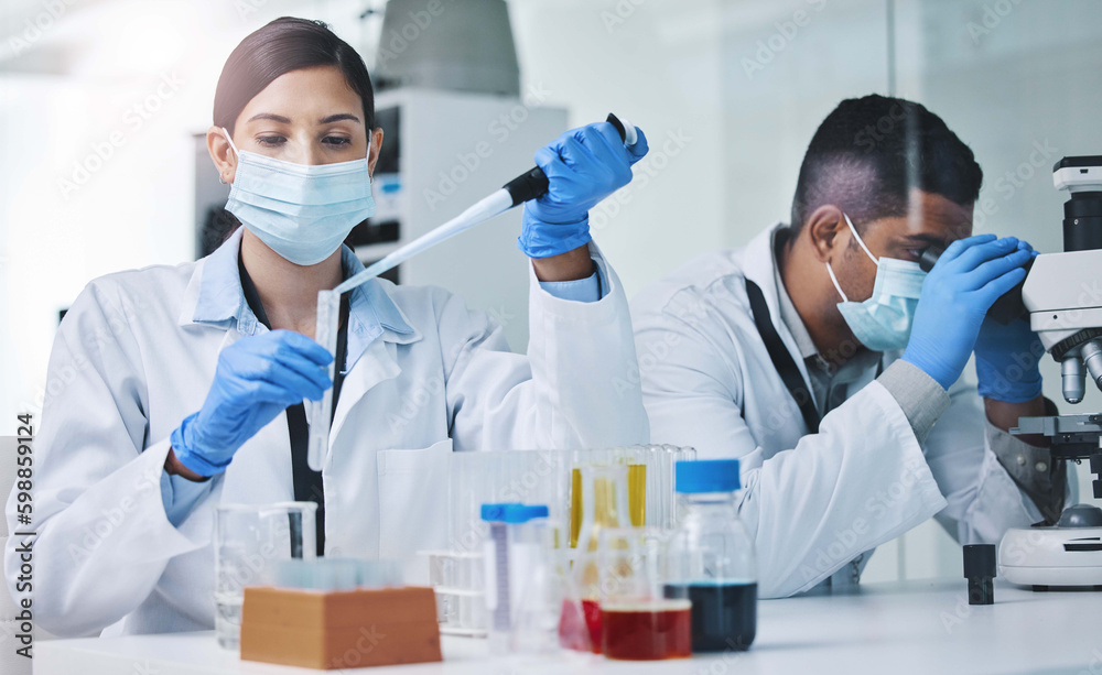Putting our skills to work. two young researchers working in a laboratory. Putting our skills to work. two young researchers working in a laboratory.