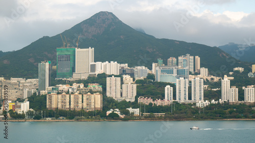 Photography View of Hong Kong Island living and business quarter cityscape with many skyscraper buildings from sea