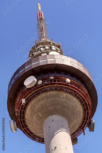 Madrid telecommunications tower filling the entire frame along with some blue sky photo