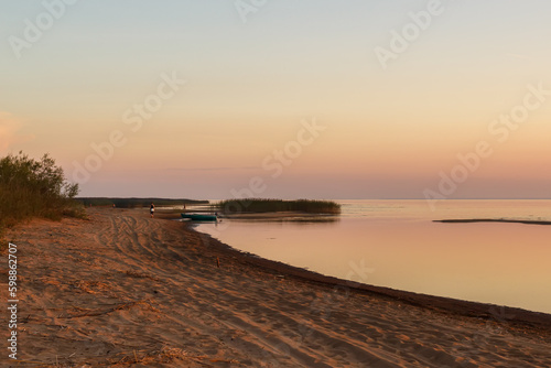 Sandy beach of Lake Ladoga on the south side at sunset