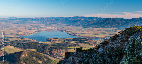 Fototapeta Naklejka Na Ścianę i Meble -  Liptovska Mara, Liptovsky Mikulas city and hills of Nizke Tatry and Slovenske rudohorie mountains from Velky Choc hill in Chocske vrchy mountains in Slovakia