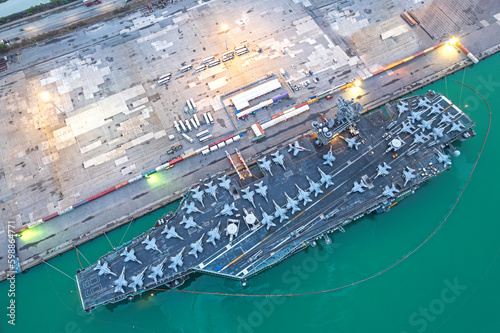 Aerial view army navy nuclear ship carrier full fighter jet aircraft concept technology of battleship.