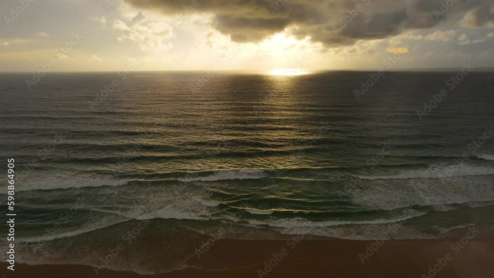 Sunset at sea Aerial view over beach cinematic video at sunset Sunset at sea Aerial view over beach cinematic video at sunset