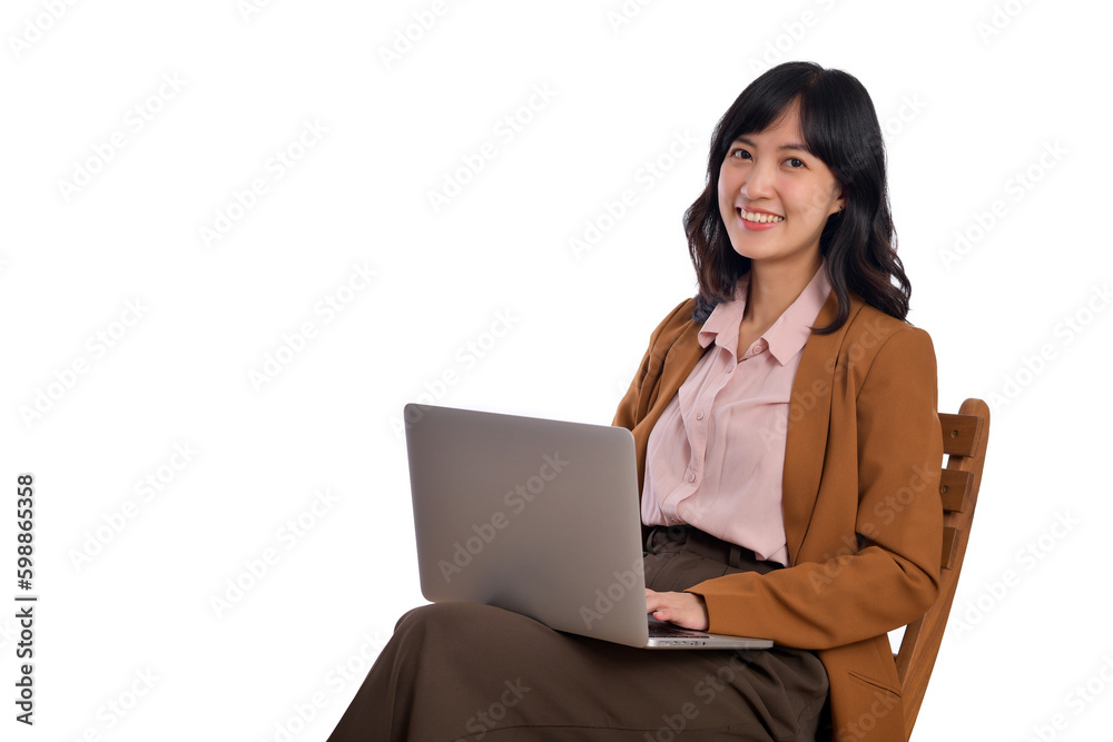 Happy young business asian woman smiling. While her using laptop sitting on wooden chair isolate on white background Happy young business asian woman smiling. While her using laptop sitting on wooden chair isolate on white background
