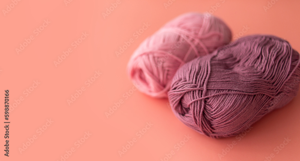 Female hobby knitting. Yarn in warm colors. The beginning of the process of knitting a women's sweater. Female hobby knitting. Yarn in warm colors. The beginning of the process of knitting a women's sweater.