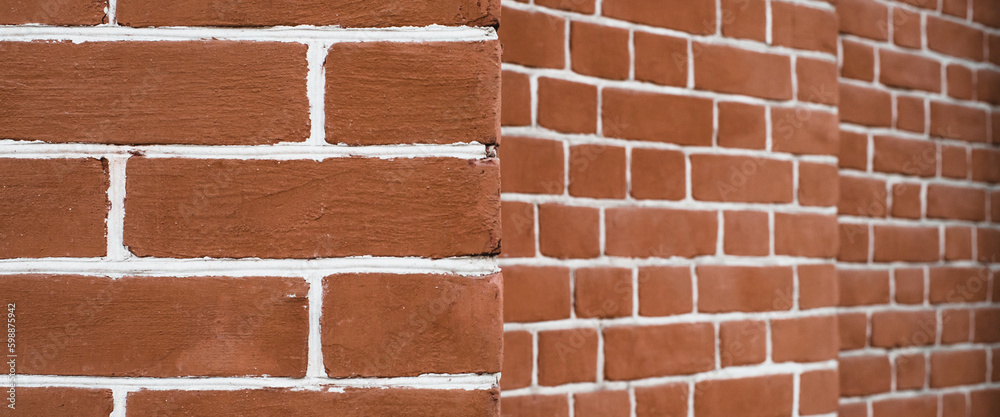 Obraz premium Minimal fragment of brick wall angle close up. Beautiful minimalist brick perspective texture backdrop. Geometric background of brick wall pattern. Modern design of interior or exterior close-up.