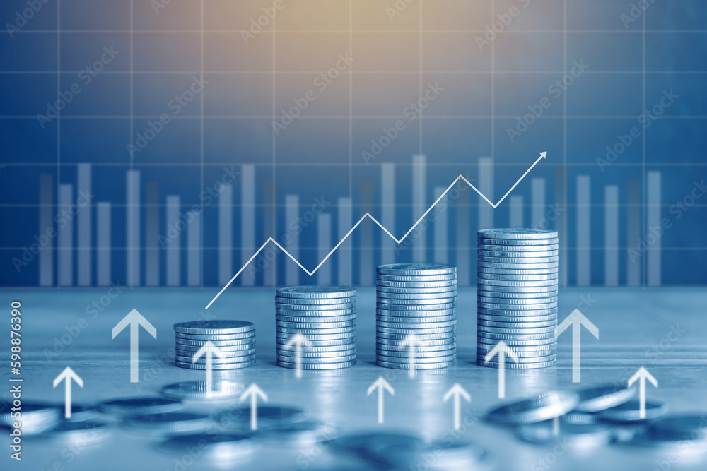 Stack of money coin with graph and chart, financial investment concept use for background with blue filter. Stack of money coin with graph and chart, financial investment concept use for background with blue filter.