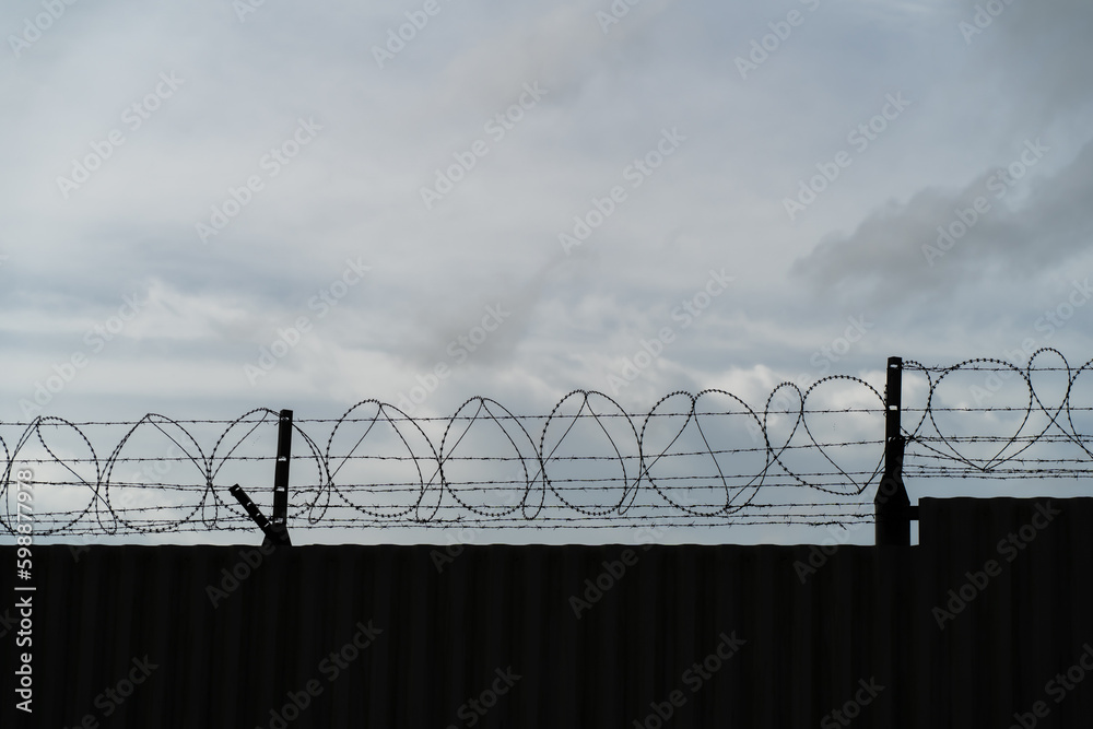 Background of prison warfare, barbed wire fence in Phuket Thailand Background of prison warfare, barbed wire fence in Phuket Thailand