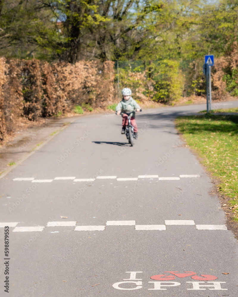 person riding a bicycle in the traffic playground in copenhagen