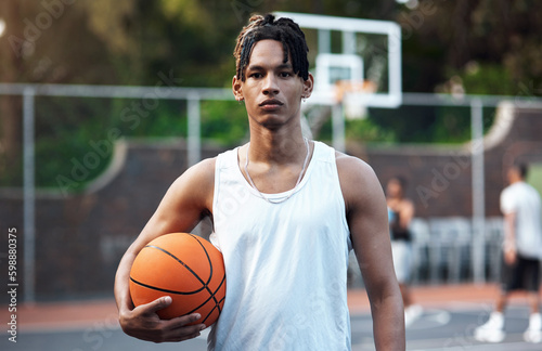 Get your game face on. Portrait of a sporty young man standing on a basketball court. © Nicholas Felix/peopleimages.com