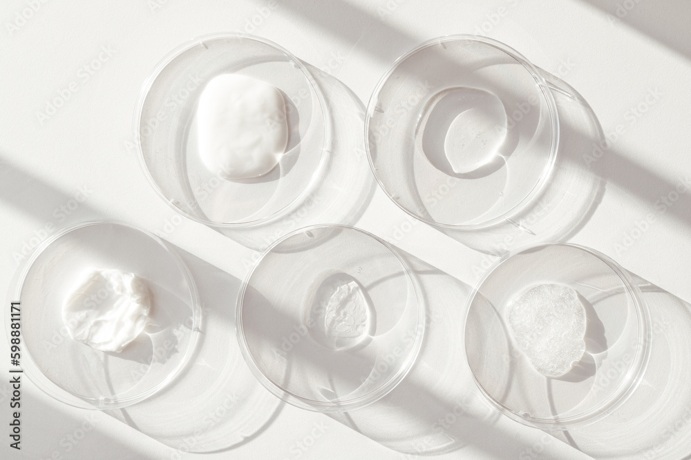 Different Cosmetics Products Samples of Gel in Laboratory Petri Dishes on white background