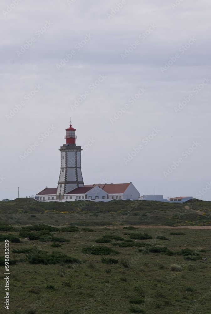 Sesimbra, Portugal - April 4, 2023: Cape Espichel Lighthouse (Lighthouse Cabo Espichel) is a coastal lighthouse located in the parish of Castelo, district of Setubal. Built in 1790. Selective focus.