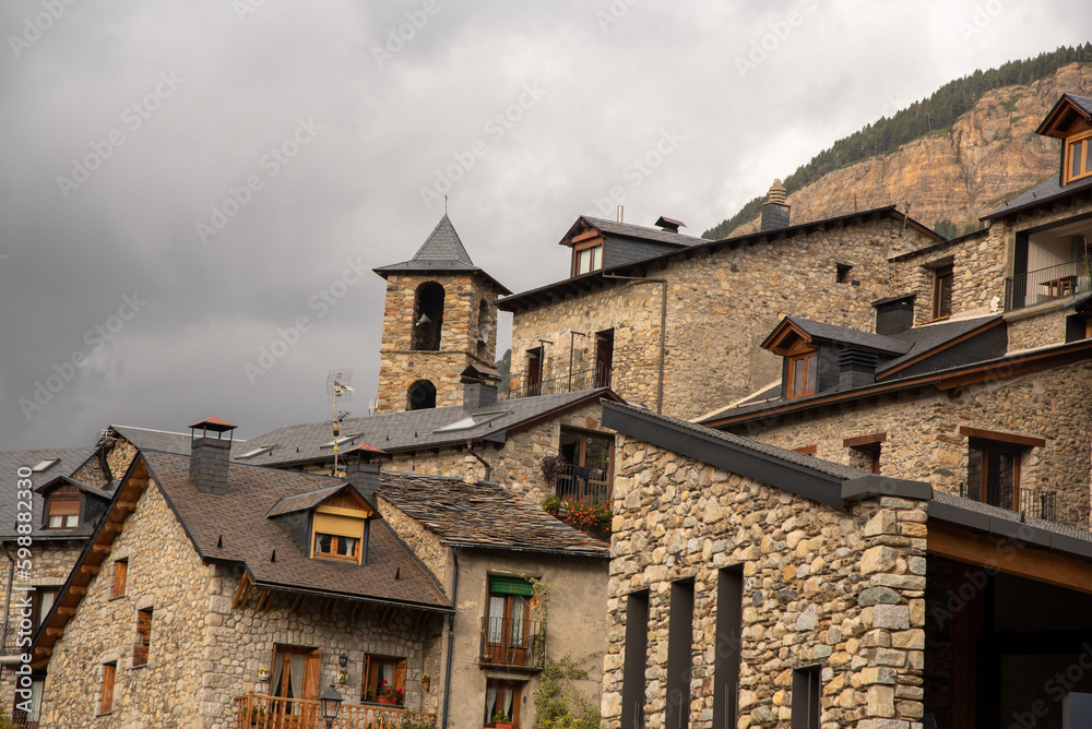 Detail shot of the roofs of some stone buildings with slate roofs in the tourist village of Cerler in Huesca on a cloudy day. Detail shot of the roofs of some stone buildings with slate roofs in the tourist village of Cerler in Huesca on a cloudy day.