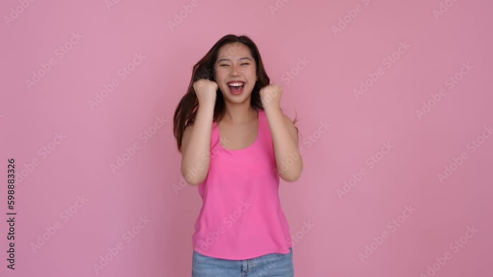 Excited young woman makes yes gesture celebrates success. Generative AI Excited young woman makes yes gesture celebrates success. Generative AI