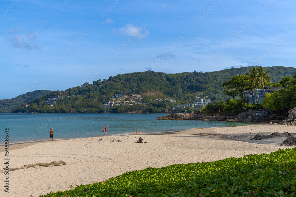 Patong Beach Phuket Thailand nice white sandy beach clear blue and turquoise waters and lovely blue skies with Palms tree Patong Beach Phuket Thailand nice white sandy beach clear blue and turquoise waters and lovely blue skies with Palms tree