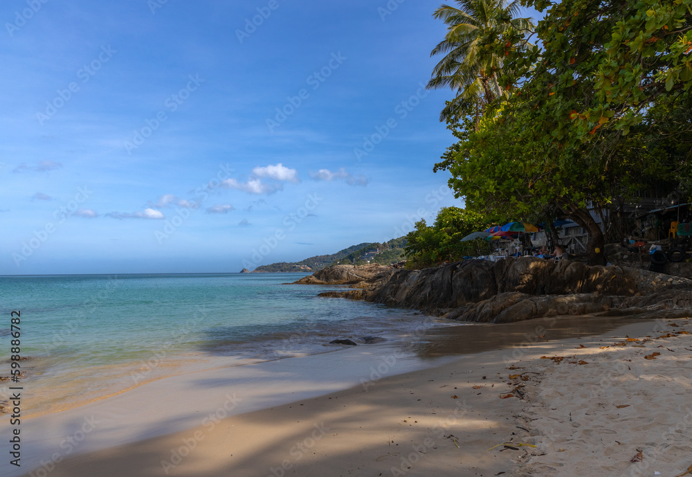 Patong Beach Phuket Thailand nice white sandy beach clear blue and turquoise waters and lovely blue skies with Palms tree Patong Beach Phuket Thailand nice white sandy beach clear blue and turquoise waters and lovely blue skies with Palms tree