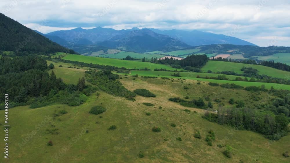 Aerial drone view to mountains, fields, green forest near Liptovska Mara in Slovakia Aerial drone view to mountains, fields, green forest near Liptovska Mara in Slovakia