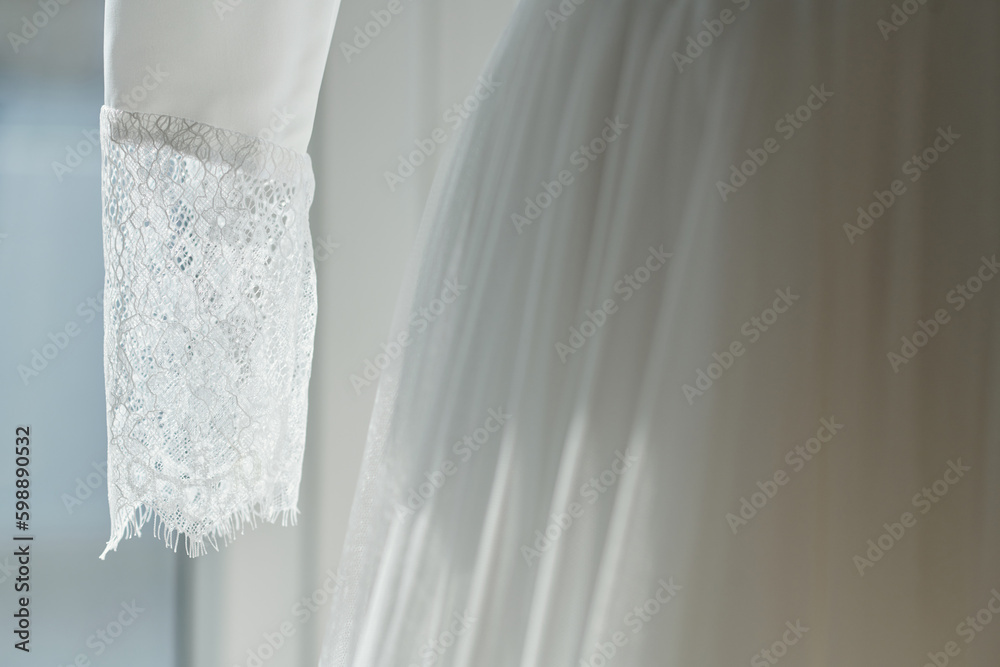 Lace sleeve of elegant gown in wedding salon Lace sleeve of elegant gown in wedding salon
