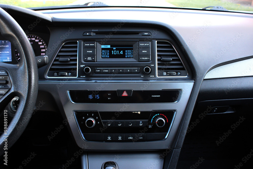 Car detailing. Car multimedia and climate control. Modern car interior details. Control temperature and security with car display. Home temperature, safety and environment.