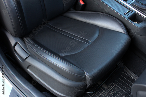 Modern luxury car black leather with alcantara interior. Part of black leather car seat. Interior of prestige car. Leather seats isolated. © Best Auto Photo