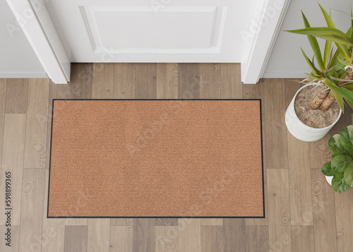 Blank brown door mat on the floor at home. Welcome mat with copy space for your text. Doormat mock up. Carpet at entrance for wiping dirty shoes. Mockup. 3D Rendering.