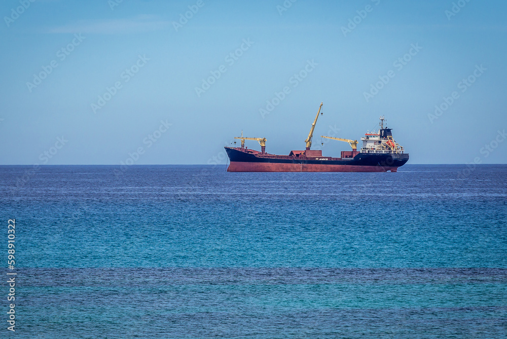 Cargo ship, view from Trapani, capital city of Trapani region on Sicily Island, Italy