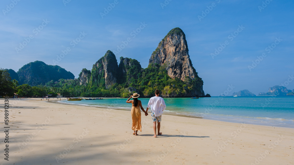 Naklejka premium A couple of men and women at Railay Beach Krabi Thailand, the tropical beach of Railay Krabi