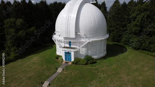 Right orbit pull out of white dome Dunlap observatory telescope in Richmond Hill, Ontario photo