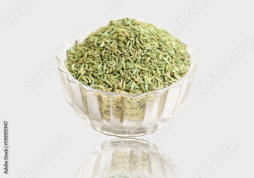 saunf, fennel seed in the transparent bowl , isolated on white Bowl. photo
