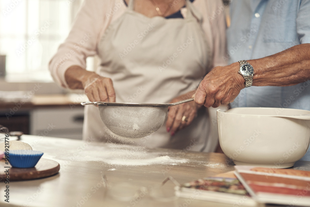 What are we baking today. an unrecognizable couple baking together at home. What are we baking today. an unrecognizable couple baking together at home.
