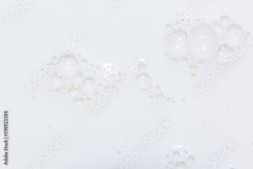 macro milk texture,White surface of milk and bubbles and ripples from above birds eye view