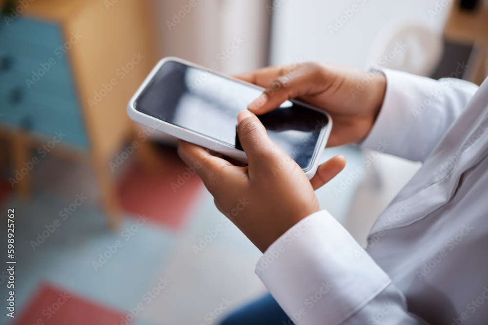Keeping connected even when were oceans apart. an unrecognisable businesswoman using a smartphone in a modern office. Keeping connected even when were oceans apart. an unrecognisable businesswoman using a smartphone in a modern office.