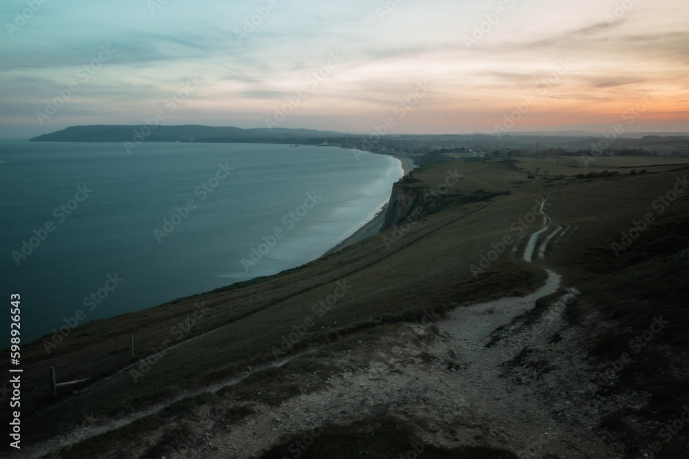 clifftop view of a sunset by the sea clifftop view of a sunset by the sea