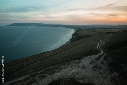 clifftop view of a sunset by the sea
